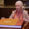 Ms Goodall reviewing African wildlife conservation photography book